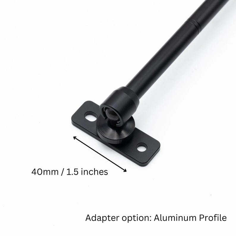 May include: Black metal window stay with a 1.5 inch adjustable arm. The stay is attached to a black metal plate with two holes. Adapter option: Aluminum Profile.