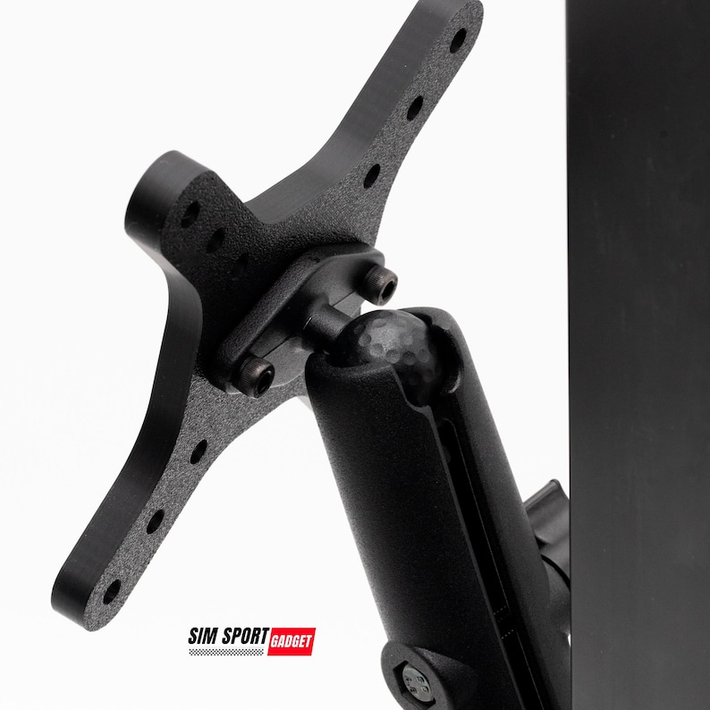 May include: Black metal bracket with multiple holes and a ball joint. The bracket is attached to a black cylindrical component. The text "SIM SPORT GADGET" is displayed in a red rectangle at the bottom.