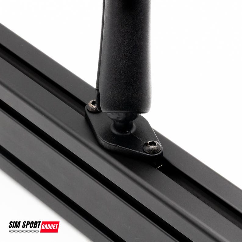 May include: Close-up of a black metal component with a mounting bracket and screws. The component is attached to a black, grooved rail. The image is set against a white background. The text "SIM SPORT GADGET" is visible at the bottom.