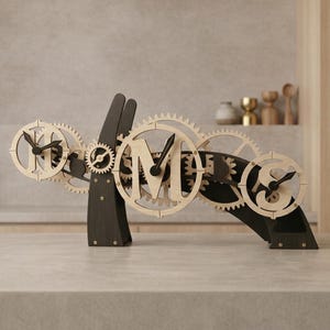 May include: A set of three ceramic mugs with a speckled, matte finish. The mugs are in shades of cream, light gray, and dark gray. Each mug has a simple, minimalist design, perfect for coffee or tea.