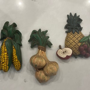 Three Ceramic Vegetable Wall Hangings