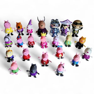 May include: A collection of colorful, small figurines of cartoon characters, including pigs, rabbits, and other animals. The figurines are in various outfits and poses, with bright colors and detailed designs. The toys are arranged on a white surface.