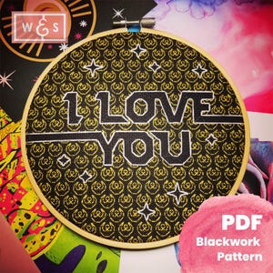 May include: Black and gold embroidery pattern featuring the text "I LOVE YOU" in a bold font. The pattern is designed for blackwork embroidery and is available as a PDF download.