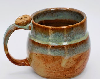 Handcrafted Stoneware mug with Lucky clover thumb rest