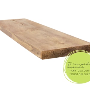 May include: A long, light brown wooden shelf, 22 cm wide, with a natural wood finish. The shelf is made of reclaimed wood and has a rustic look. The text on the image reads "22 cm width boards * ANY COLOUR * CUSTOM SIZE".