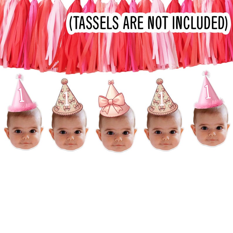 May include: Pink and white birthday banner with five images of babies wearing pink party hats. The banner says "(TASSELS ARE NOT INCLUDED)".