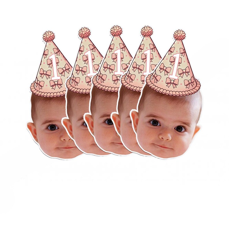May include: Set of five pink and white party hats with a number one and bows. Each hat has a white background with pink polka dots and pink bows. The number one is white and the bows are pink. The hats are on a white background.