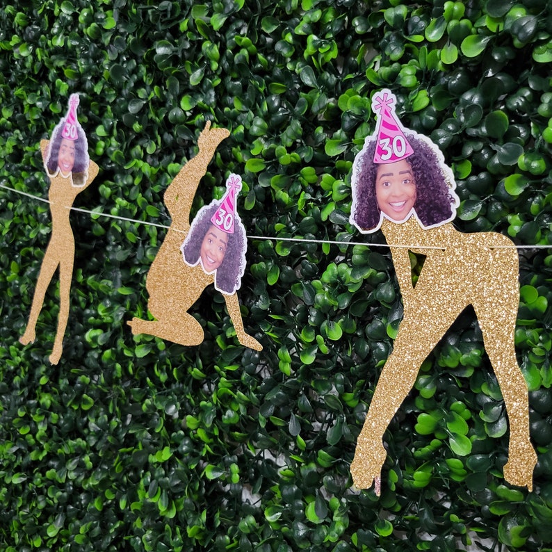 a birthday party banner is shown featuring hilarious female dancer poses that have the birthday person's face applied to the dancers, the birthday person's face also has a brightly colored birthday hat applied with their birthday age