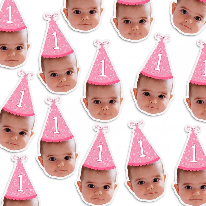May include: A sheet of pink and white stickers featuring a baby wearing a pink party hat with the number "1" on it. The stickers are ideal for a first birthday party.