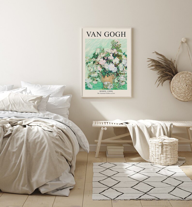May include: A framed print of a painting by Vincent van Gogh titled "Roses, (1890)". The painting depicts a vase of white roses with a green background. The text "VAN GOGH" is at the top of the frame and the text "ROSES, (1890) The National Gallery of Art" is at the bottom of the frame.