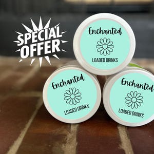 May include: Three white containers with teal lids are stacked. Each lid has the word "Enchanted" in black script, a daisy graphic, and the words "LOADED DRINKS". A "SPECIAL OFFER" graphic is in the upper left.
