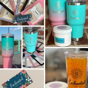 May include: A collection of Enchanted Loaded Teas products, including a variety of tea mixes, a pink and turquoise tumbler, and a white jar with the text "Sunny Daze". The image also includes a business card with the text "Enchanted Loaded Teas" and contact information for ordering on Etsy.