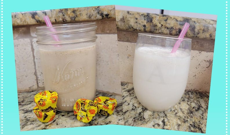 May include: Two drinks, one in a mason jar and the other in a stemless glass, each with a pink straw. The mason jar drink is light brown, and the glass drink is white. Three candies in yellow and orange wrappers are in front of the mason jar.