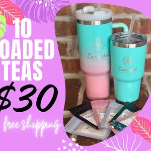 May include: 10 Loaded Teas for $30 with free shipping. Two teal and pink stainless steel tumblers with the logo "Enchanted Tea Co." and a variety of tea bags.