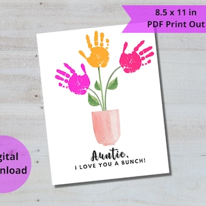 May include: Printable 8.5 x 11 inch card with a pink flower pot and three handprint flowers. The flowers are pink and yellow. The card says "Auntie, I love you a bunch!"