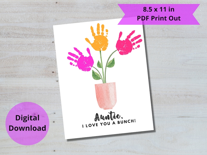 May include: Printable 8.5 x 11 inch card with a pink flower pot and three handprint flowers. The flowers are pink and yellow. The card says "Auntie, I love you a bunch!"