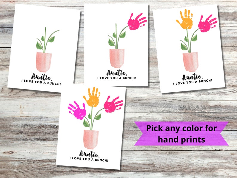 May include: Four printable cards with a handprint flower design. The cards say "Auntie, I love you a bunch!" and feature a pink pot with a green plant and handprints in pink, orange, and yellow. The text "Pick any color for hand prints" is written on a purple banner.