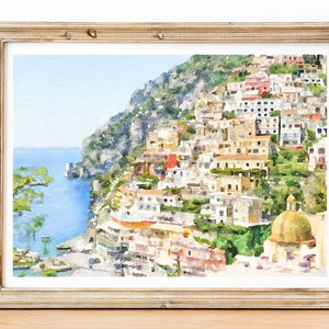 Puede incluir: Pintura acuarela de un colorido pueblo italiano construido en un acantilado con vistas al océano. El pueblo está pintado en tonos de amarillo, naranja, rojo y verde. El océano es de color azul claro. La pintura está enmarcada en un marco marrón claro.