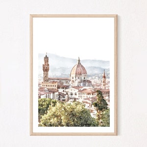 Puede incluir: Una impresión en acuarela enmarcada que representa el horizonte de Florencia, con la icónica cúpula de terracota de la Catedral de Santa Maria del Fiore, la torre del Palazzo Vecchio y edificios circundantes, enmarcados por árboles verdes en primer plano.