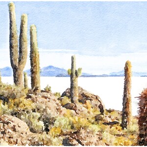 May include: A watercolor painting of a desert landscape with tall cacti growing on a rocky hillside. The cacti are green and brown, and the background is a hazy blue sky with a distant mountain range. The painting has a soft, dreamy feel.