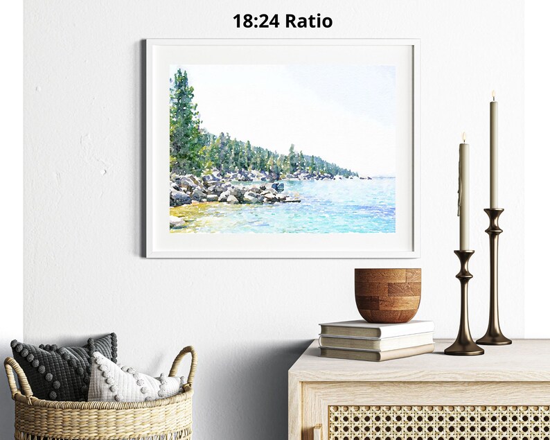May include: A watercolor painting of a lake scene with a forest in the background. The lake is a light blue color and the forest is a dark green color. The painting is framed in a white frame.