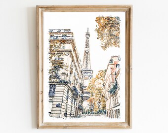 May include: A framed watercolour print depicting a Parisian street scene with the Eiffel Tower in the background. The artwork features tall stone buildings, autumn-toned trees with orange and brown foliage, and a light-coloured sky in a vertical orientation.
