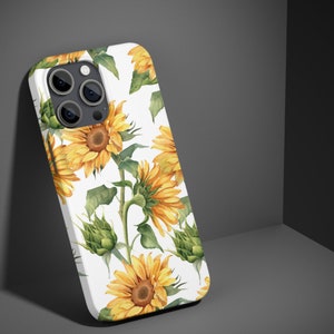 May include: White iPhone case with a floral design featuring yellow sunflowers on a white background.