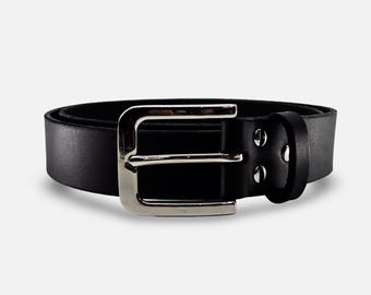 May include: A black leather belt with a silver-colored buckle. The belt is made of smooth, solid black leather and features a rectangular silver buckle. The belt is a classic accessory.