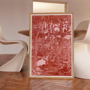 Peut inclure: Une estampe encadrée d'une illustration rouge et blanche d'une scène de forêt avec un oiseau dans un étang. L'estampe est dans un cadre en bois.