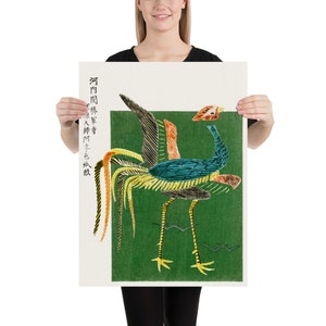 May include: A vintage Japanese woodblock print of a rooster with a green background. The rooster is depicted in a stylized manner with a long, flowing tail and a bright blue body. The print is framed with a white border and includes Japanese text.