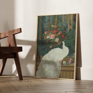 May include: A framed art print featuring a white peacock with its tail feathers displayed. The artwork is set against a backdrop of lush greenery and colorful flowers, with a gold-toned frame.