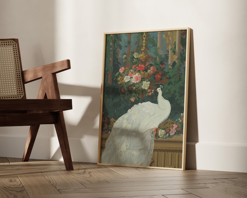 May include: A framed art print featuring a white peacock with its tail feathers displayed. The artwork is set against a backdrop of lush greenery and colorful flowers, with a gold-toned frame.