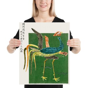May include: A vintage Japanese woodblock print depicting a colorful rooster with a long tail, standing on a green background. The text in the image reads "河内國 堺 堺町 字 色染 阪".