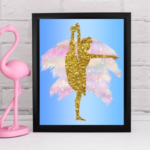 May include: A framed print with a gold glitter silhouette of a dancer on a blue background with pink and white brushstrokes.