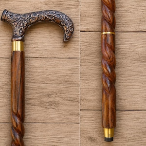 Pode incluir: Bengala de madeira com um eixo torcido castanho escuro e um cabo decorativo. O cabo é de cor bronze com um design floral ornamentado. A bengala tem detalhes metálicos dourados na parte superior e inferior do eixo.