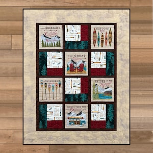 May include: A quilted wall hanging with nine square panels. Each panel features outdoor-themed imagery and text, including mountains, canoes, and phrases like "Adventure Awaits" and "Explore More." The color palette includes shades of brown, red, green, and cream.