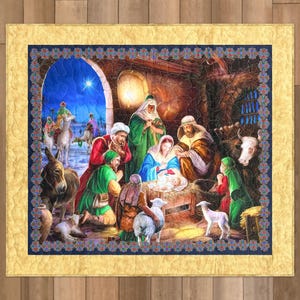 May include: A quilted wall hanging depicting the Nativity scene. The artwork features Mary, Joseph, and baby Jesus, surrounded by figures in colourful robes, animals, and a bright star in the night sky. The quilt has a gold border.