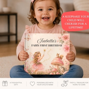 May include: A hardcover book titled Isabella's Fairy First Birthday, featuring a whimsical illustration of a fairy with a wand, a squirrel on a mushroom, and a hedgehog, surrounded by pink flowers and butterflies on a light background.