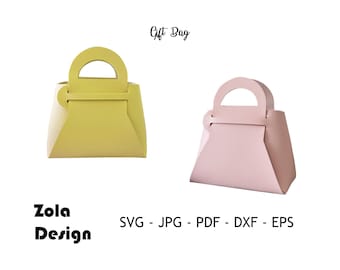 Könnte beinhalten: Zwei Geschenktüten, eine gelbe und eine rosa, mit einem Griff und einem Klappverschluss. Der Text "Gift Bag" befindet sich über den Taschen. Der Text "Zola Design" befindet sich unter den Taschen. Der Text "SVG - JPG - PDF - DXF - EPS" befindet sich unter dem Text "Zola Design".
