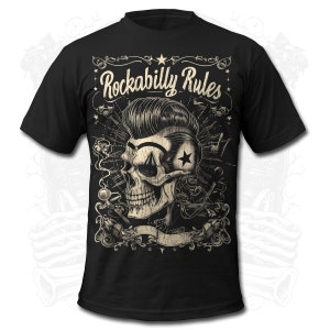 May include: Black t-shirt with a vintage-style illustration of a skull with a pompadour hairstyle. The skull is surrounded by musical notes and other retro design elements. The text "Rockabilly Rules" is printed in a bold, stylized font.