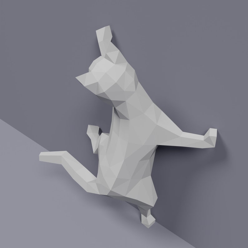 May include: A white origami cat sculpture in a playful pose, with its front paws raised and its back legs extended. The sculpture is made of folded paper and has a geometric design.