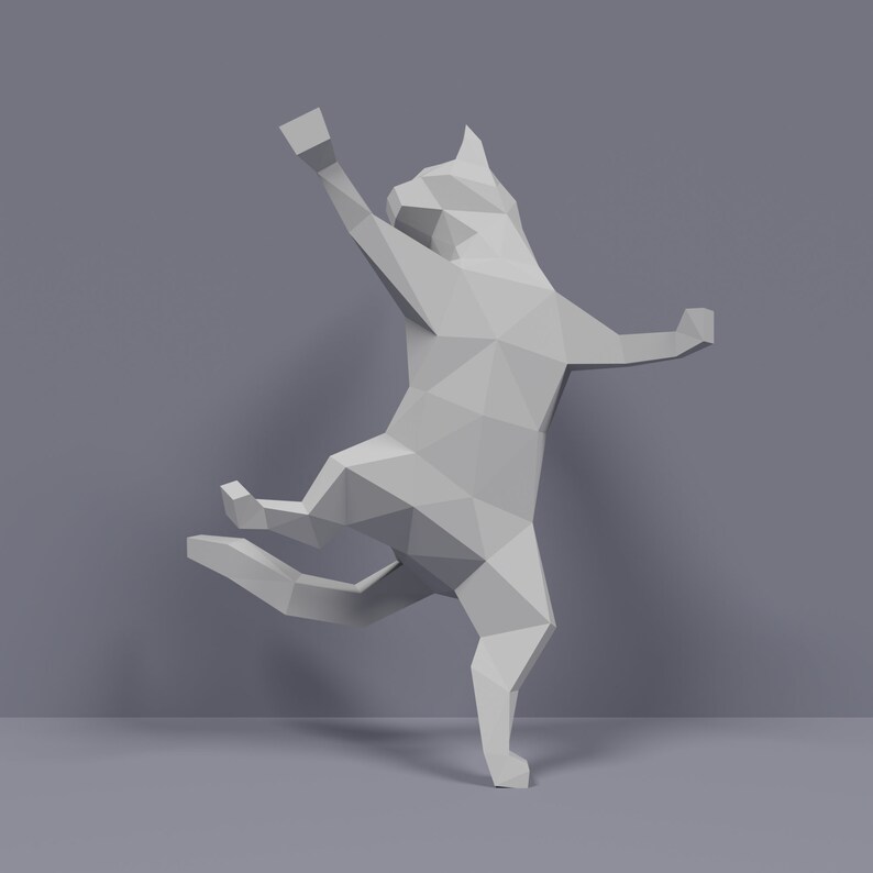 May include: A white, geometric, origami-style cat sculpture with a playful pose. The cat is standing on its hind legs with its front paws raised in the air.