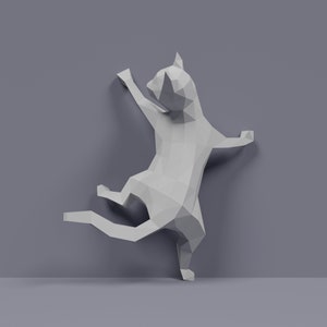 May include: A white origami cat sculpture in a playful pose, with one paw raised and its body contorted, as if it is climbing a wall.