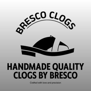 May include: A logo for Bresco Clogs, featuring a stylized black clog design. The text "BRESCO CLOGS" arches above the clog image, with "HANDMADE QUALITY CLOGS BY BRESCO" below. The tagline "Crafted with love and precision" is at the bottom.