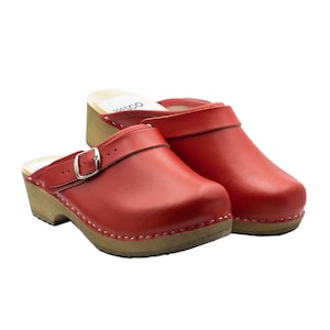 Closed handmade wooden clogs with a decorative buckle made from real leather and alder wood for women and men by BrescoClogs in red colour