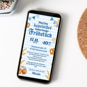 May include: A blue and white invitation for a Bavarian birthday breakfast. The invitation features a blue and white checkered background with a blue banner that says "Martins bayrisches Geburtstags-Fr&uuml;hst&uuml;ck". The invitation also includes the date and time of the event, the address, and a list of food and drinks that will be served. The invitation is on a smartphone screen.