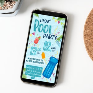 May include: A smartphone displaying a colorful invitation to a pool party. The invitation features the text "Lucas' Pool Party" and the date "18. Juni 2023". The invitation also includes a blue inflatable pool float, a red drink with a slice of watermelon, and a yellow popsicle.