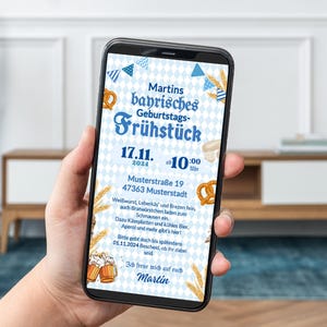 May include: A blue and white smartphone screen displaying a digital invitation to a Bavarian birthday breakfast. The invitation features a pretzel, beer steins, and wheat stalks. The text reads "Martins bayrisches Geburtstags-Fr&uuml;hst&uuml;ck 17.11. 2024 10:00 Uhr Musterstra&szlig;e 19 47363 Musterstadt".