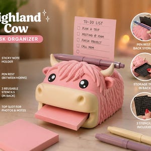 May include: A pink Highland Cow desk organizer featuring a slot for sticky notes, a pen rest between the horns, and a rear storage tray. The organizer includes three reusable stencils and a top slot for photos and notes, with text reading Highland Cow.