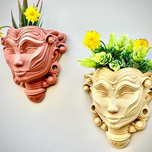 Maceta de pared con cara de mujer impresa en 3D